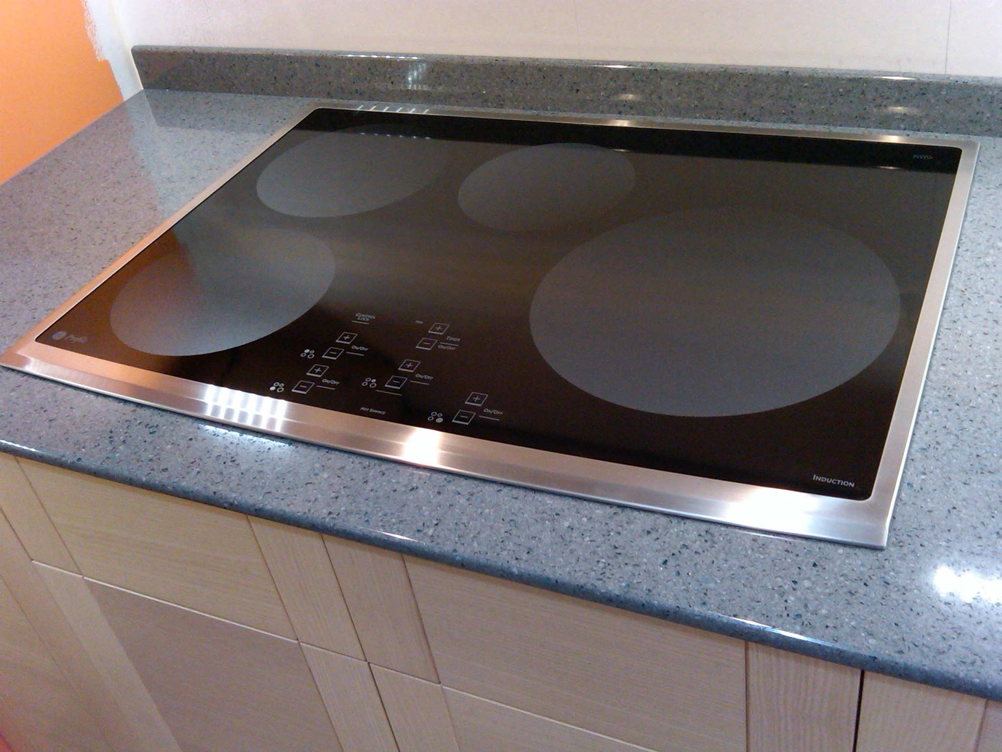 induction stove closeup on finished countertop